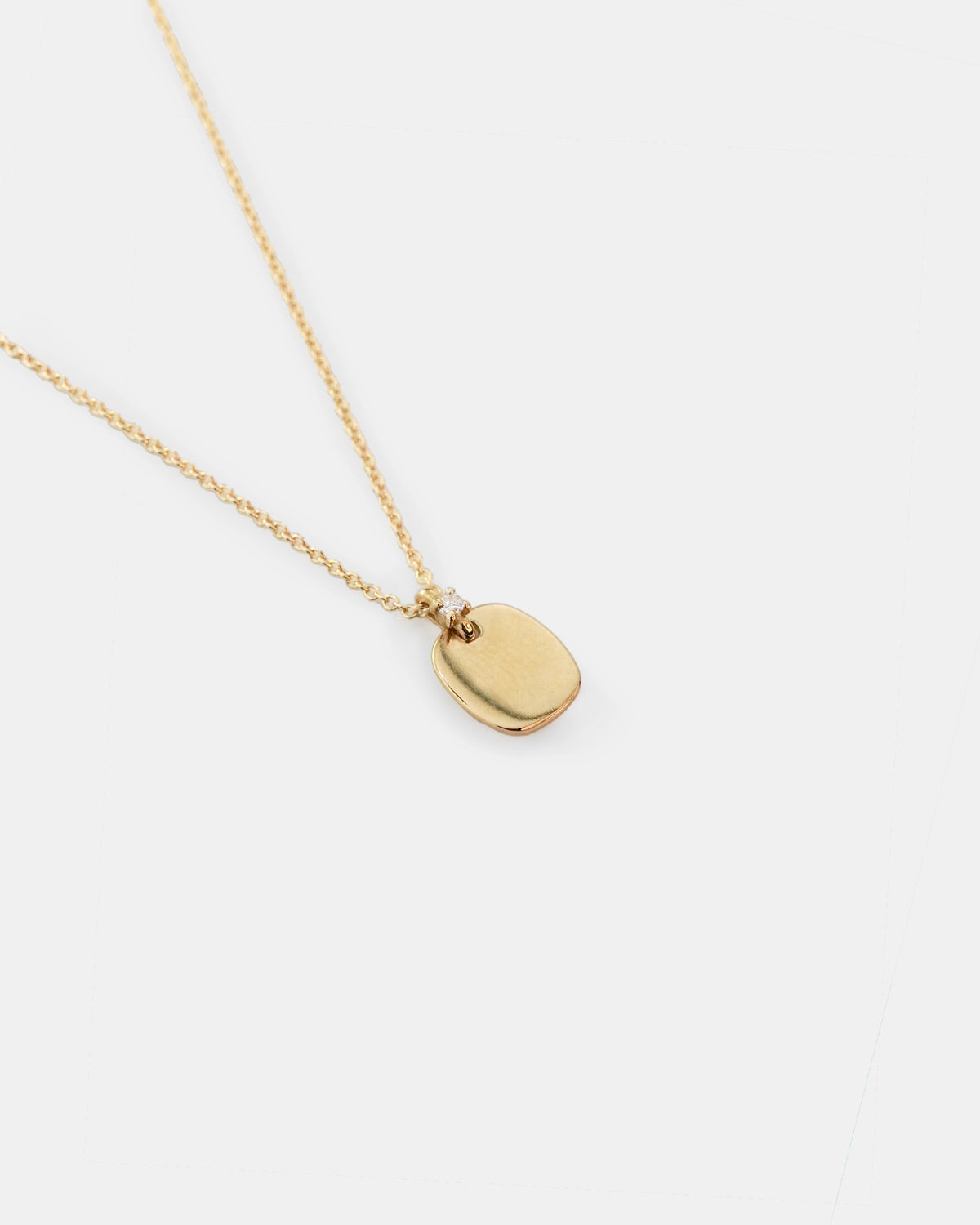 Yellow gold necklace with rectangular pendant and diamond detail