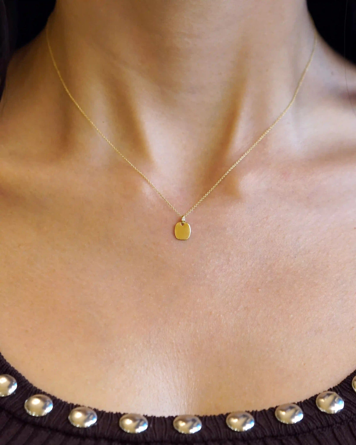 Yellow gold necklace with rectangular pendant and diamond detail