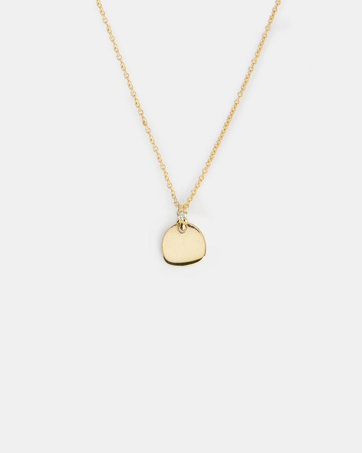 Yellow gold necklace with pebble pendant and diamond detail