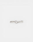 White gold solitaire ring with bypass-style band