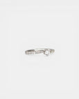White gold solitaire ring with bypass-style band