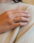 White gold solitaire ring with bypass-style band